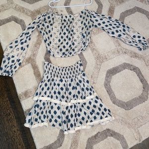 Matching off the shoulder top with skirt.